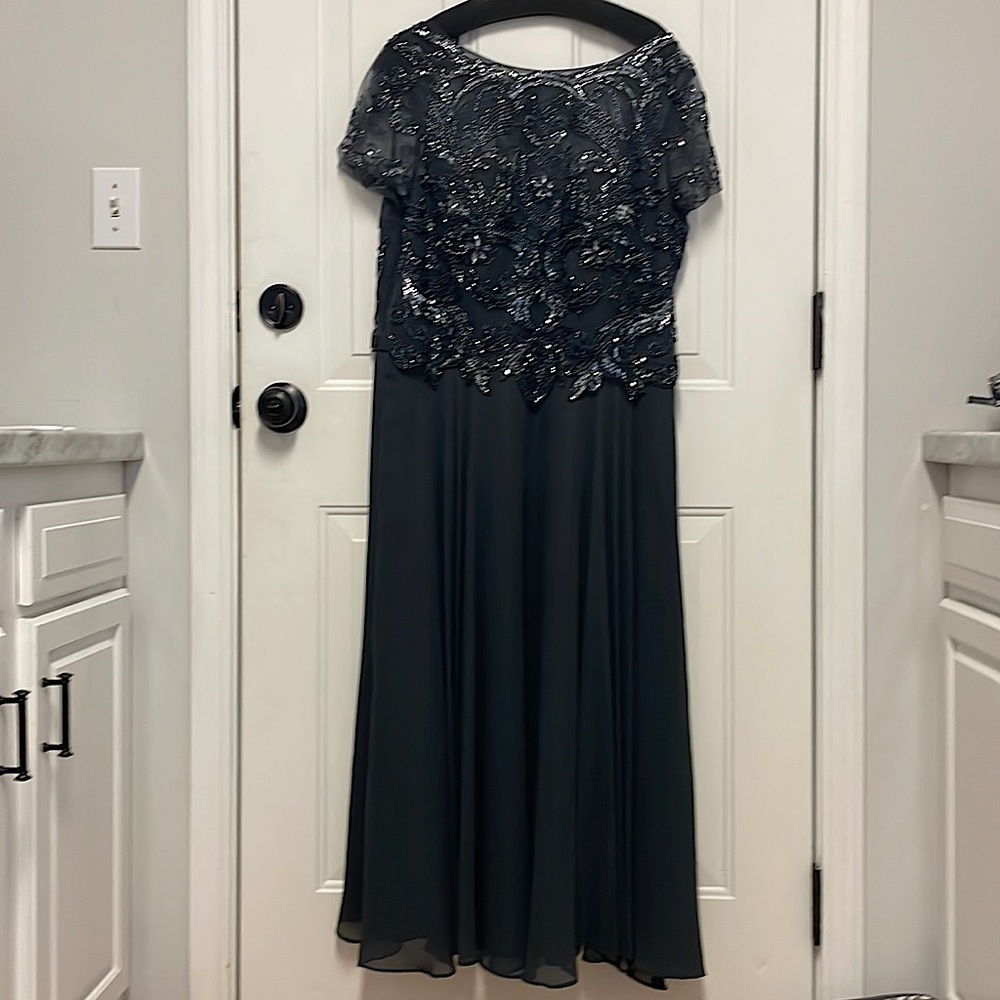 Formal dress worn as mother of groom, lots of beading and sequins. Very elegant